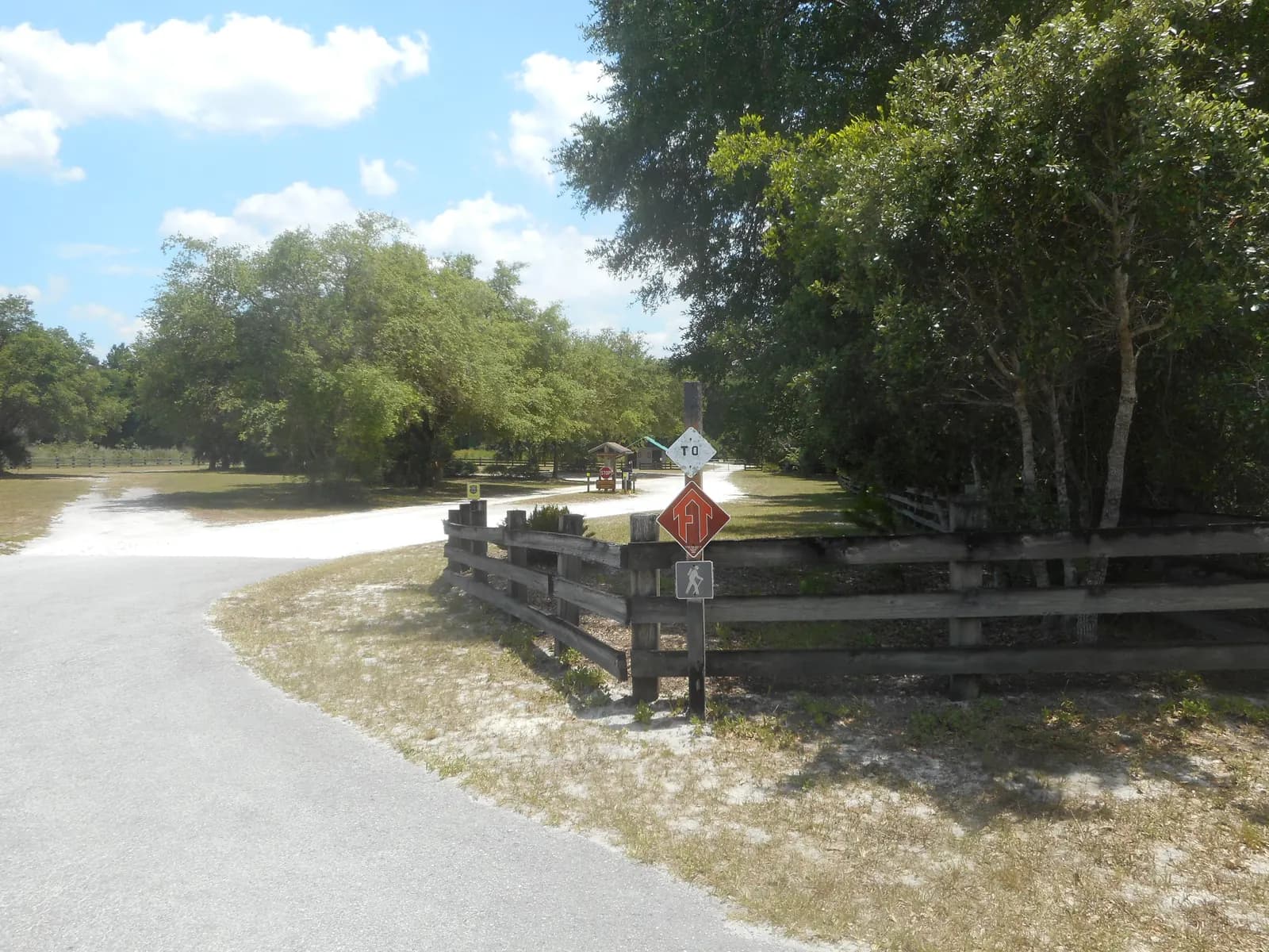 Sign directing campers and hikers leading toward the Florida National Scenic Trail at the Cassia Trailhead of the Seminole State Forest along the sout